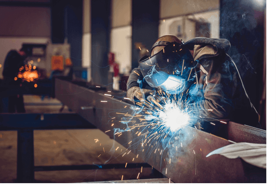 man welding steel