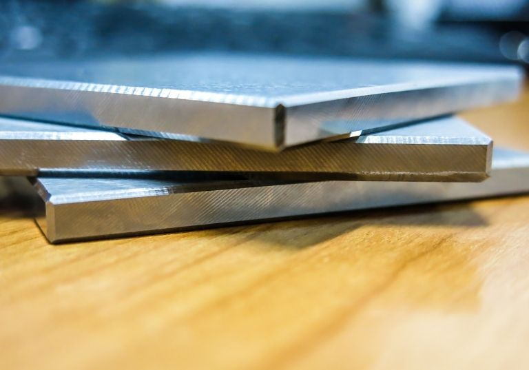 a close up of three metal sheets