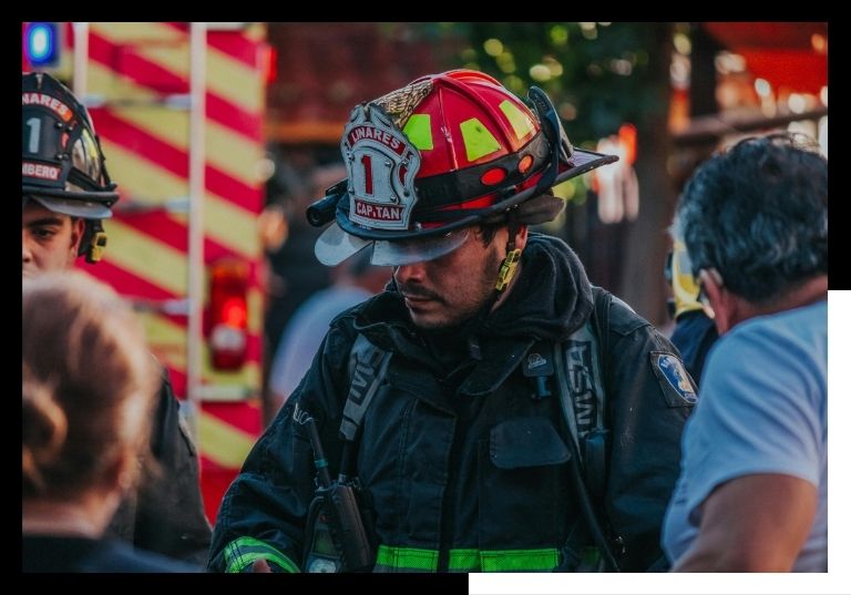firefighter working with citizens
