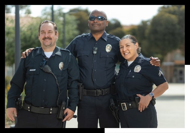 police officers smiling with arms around each other